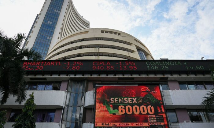 A digital display board can be seen in front of the Bombay Stock Exchange (BSE) building to celebrate the Sensex Index benchmark, which exceeded 60,000 points in Mumbai, India, on September 24, 2021.  (PunitParanjpe / AFP via Getty Images)