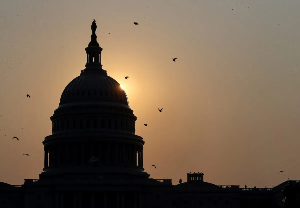 The sun rises behind U.S. Capitol on Sept. 13, 2021.(Jonathan Ernst/Reuters)