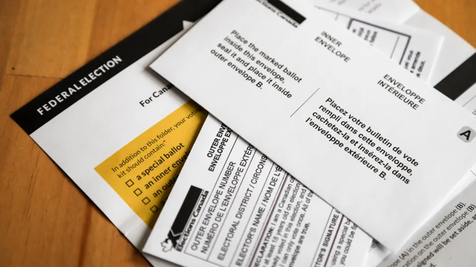 A mail-in voting package that voters will receive if requested is seen in Calgary, Alta., on Sept. 2, 2021. (The Canadian Press/Jeff McIntosh)