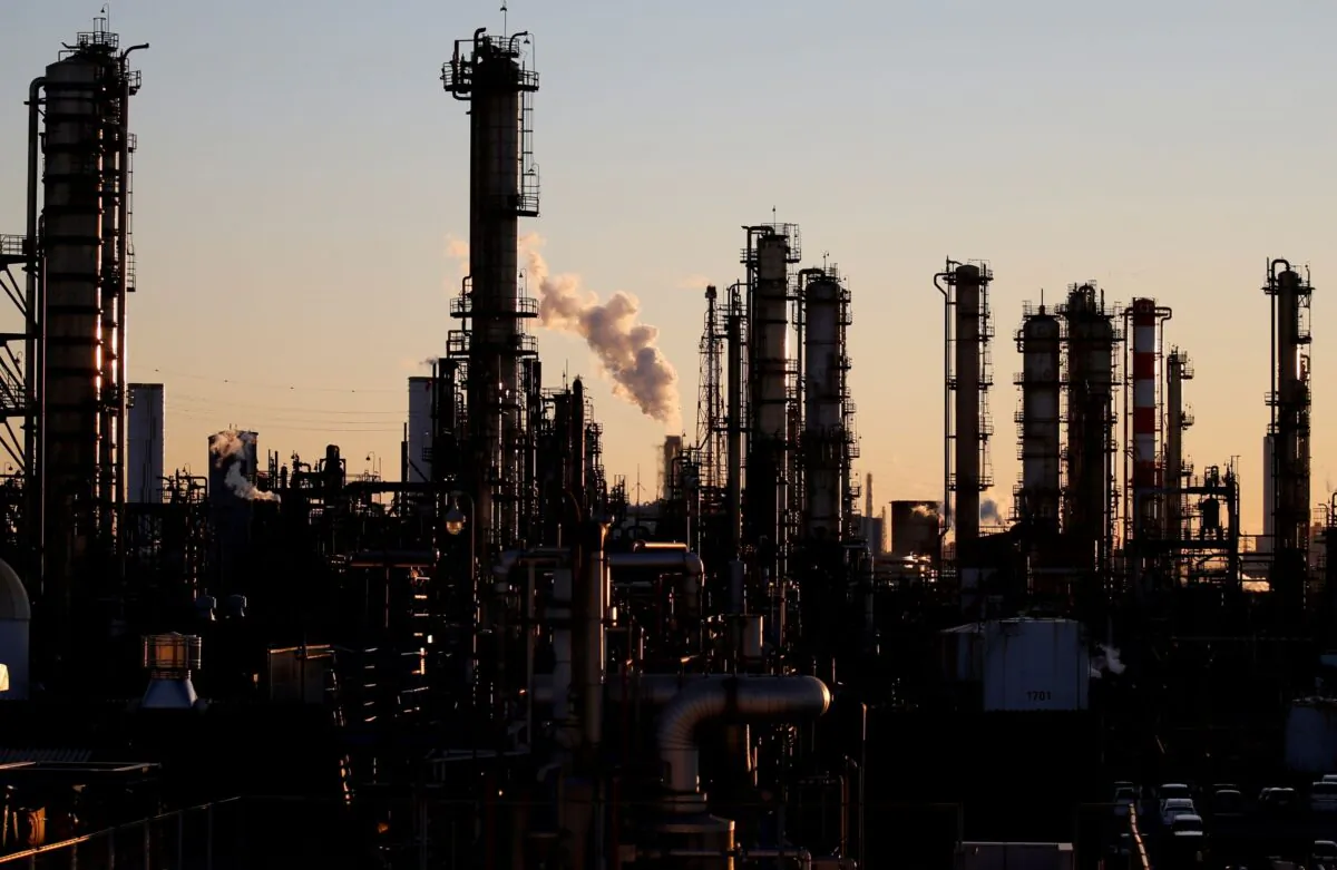 Smoke rises from a factory during the sunset at Keihin industrial zone in Kawasaki, Japan, on Jan. 16, 2017. (Toru Hanai/Reuters)