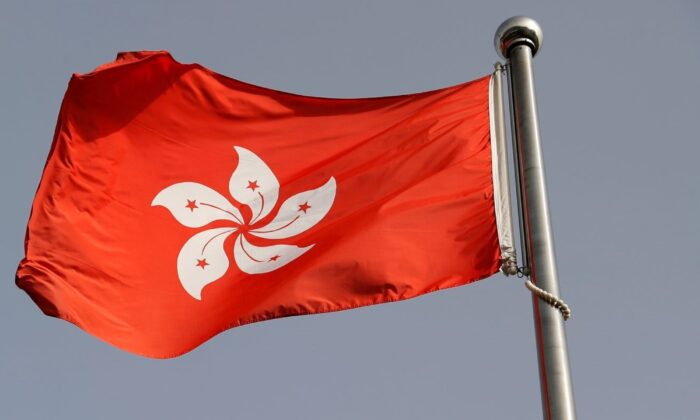 The Hong Kong flag flutters outside the Hong Kong government office on June 3, 2020. (Carlos Garcia Rawlins/Reuters)