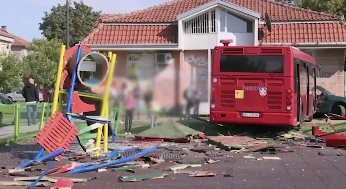 A public bus swerves off the road into a children’s playground in a residential area of Belgrade, Serbia, on Sept. 24, 2021. (Tanjug via AP/Screenshot via NTD)