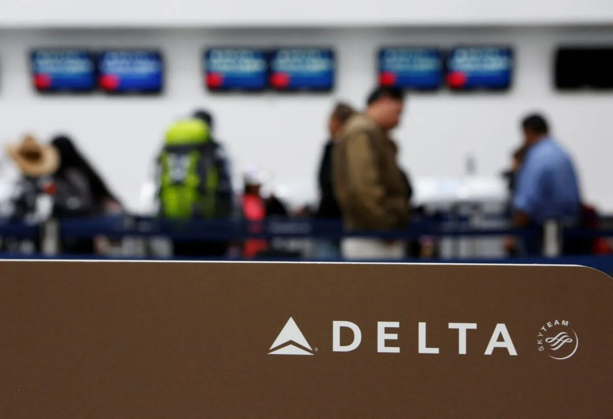 Passengers check in at a counter of Delta Air Lines in Mexico City, Mexico, on Aug. 8, 2016. (Ginnette Riquelme/Reuters)