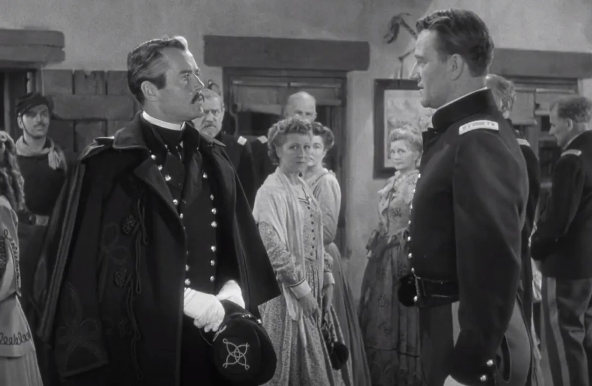 (Foreground) Lt. Col. Owen Thursday (Henry Fonda, L) and Capt. Kirby York (John Wayne) don’t exactly see eye-to-eye, in “Fort Apache.” (RKO Radio Pictures)