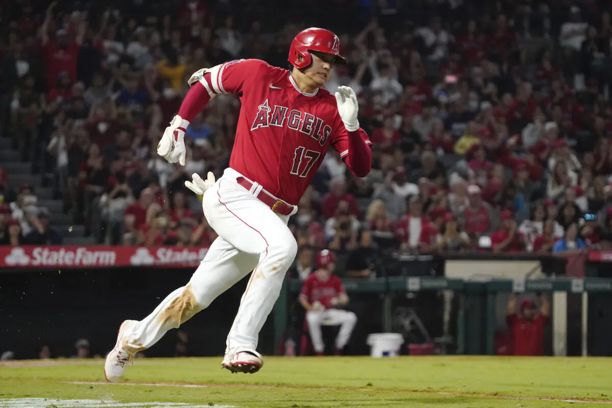 Los Angeles Angels designated hitter Shohei Ohtani rounds first on his way to a triple during the third inning of a baseball game against the Seattle Mariners in Anaheim, Calif., on Sept. 25, 2021. (AP Photo/Mark J. Terrill)