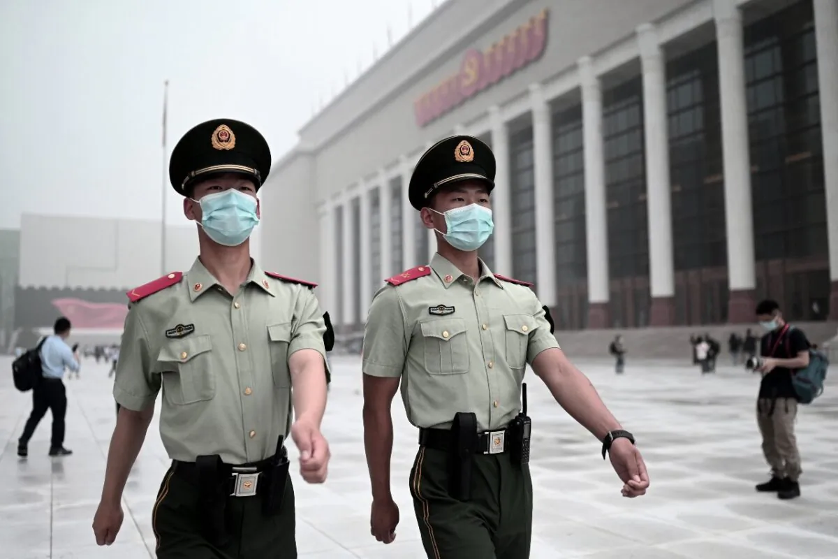 Paramilitary police walk outside the Museum of the Chinese Communist Party near the Birds Nest national stadium in Beijing on June 25, 2021. (Noel Celis/AFP via Getty Images)