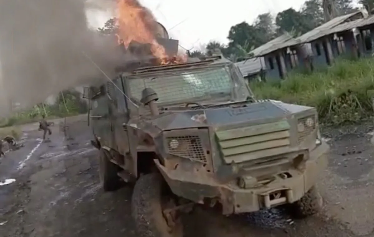 A screenshot from a video released by Ambazonia rebels showing an armored personnel carrier on fire on Sept. 14 in the Northwest region of Cameroon. (screenshot Ambazonia rebel video/The Epoch Times)