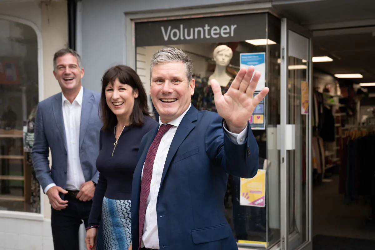 UK Labour Party leader Sir Keir Starmer (R), shadow chancellor Rachel Reeves, and Hove MP Peter Kyle during a visit to businesses in Hove, East Sussex where they met shop keepers and local people before attending the second day of the Labour Party annual conference in Brighton on Sept. 26, 2021. (Stefan Rousseau/PA)
