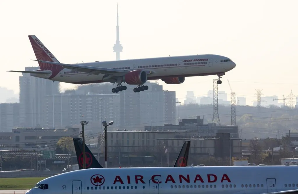 Air India flight 187 from New Delhi lands at Pearson Airport in Toronto on April 23, 2021. (The Canadian Press/Frank Gunn)