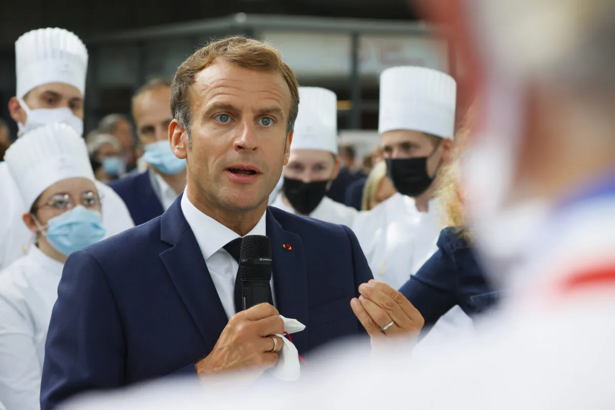 French President Emmanuel Macron speaks as he visits the International Catering, Hotel and Food Trade Fair (SIRHA) in Lyon, central France, on Sept. 27, 2021.(Denis Balibouse/Pool via AP)