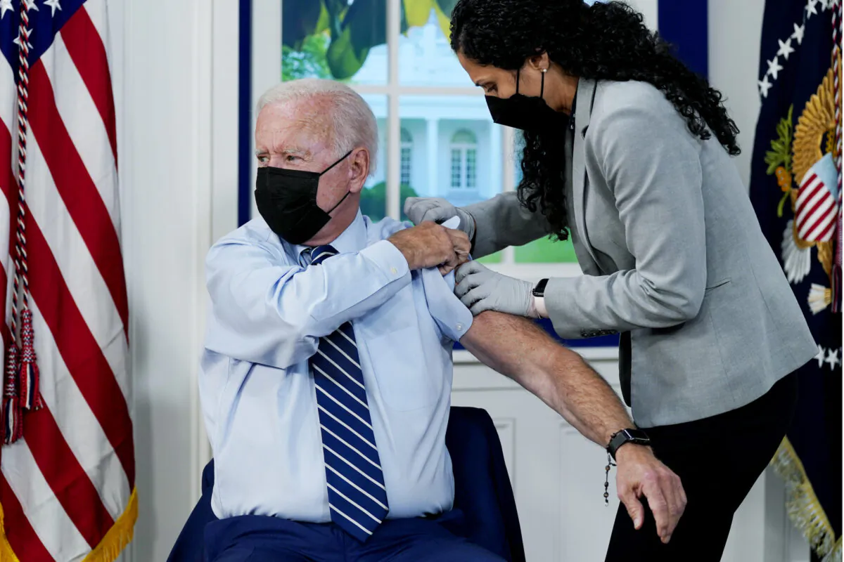 President Joe Biden receives a COVID-19 booster shot during an event in the South Court Auditorium on the White House campus in Washington on Sept. 27, 2021. (Evan Vucci/AP Photo)
