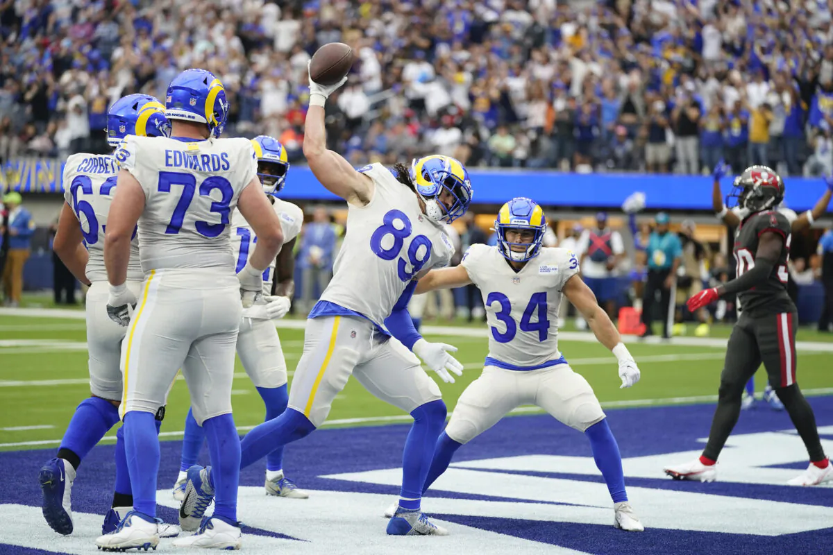 Los Angeles Rams tight end Tyler Higbee (89) celebrates after his touchdown catch during the first half of an NFL football game against the Tampa Bay Buccaneers in Inglewood, Calif., on Sept. 26, 2021. (AP Photo/Jae C. Hong )