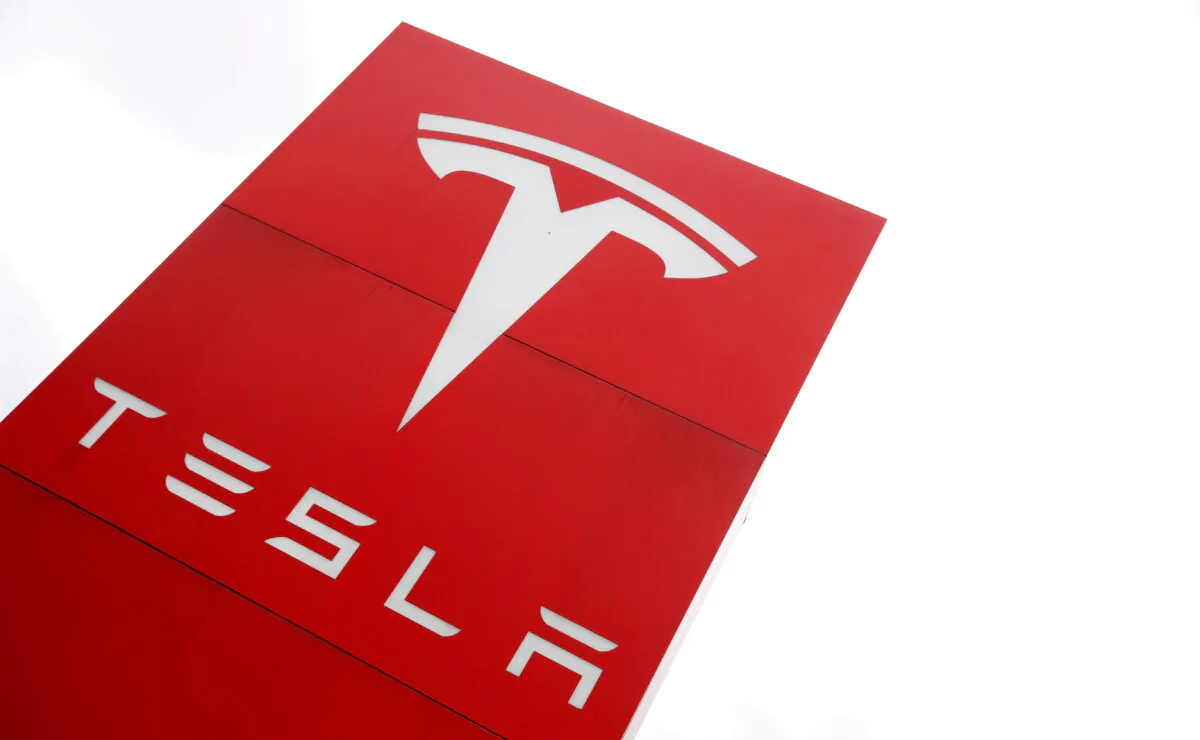 The logo of car manufacturer Tesla is seen at a dealership in London, Britain on May 14, 2021. (Matthew Childs/Reuters)