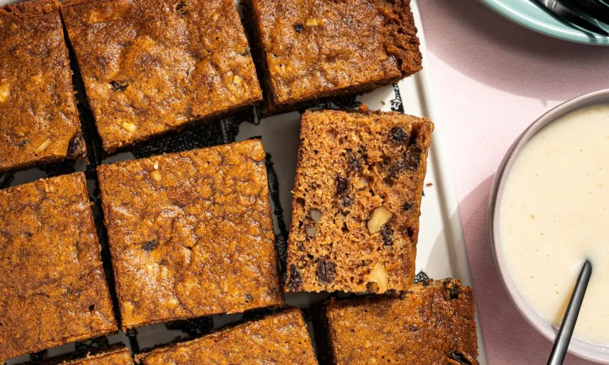 A decadent hot rum sauce jazzes up this classic spiced cake. (Eric Kleinberg/TNS)