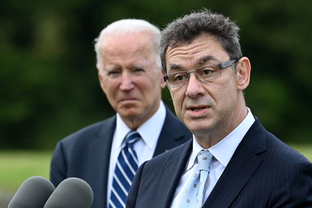 Pfizer CEO Albert Bourla, right, speaks as U.S. President Joe Biden listens, in Carbis Bay, Cornwall, on June 10, 2021. (Brendan Smialowski/AFP via Getty Images)