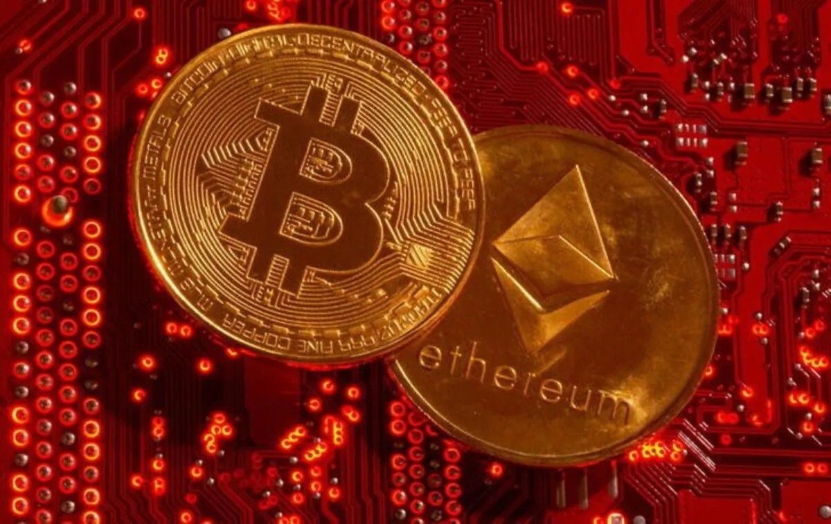 Representations of cryptocurrencies Bitcoin and Ethereum are placed on PC motherboard in this illustration taken, on June 29, 2021. (Dado Ruvic/Illustration/Reuters)