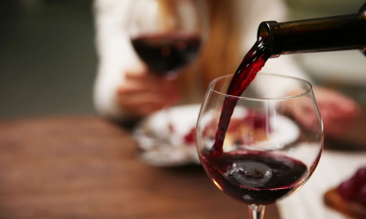 Fifty-five percent of survey respondents said warning labels stating the serious health risks of alcohol would make them think about the harms caused by alcohol either to a small or moderate extent. (shutterstock/Africa Studio)