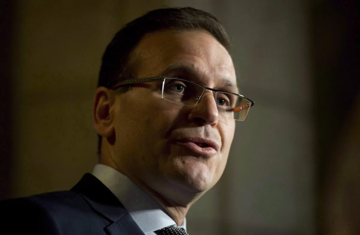 Sen. Leo Housakos speaks with the media in the Foyer of the Senate on Parliament Hill in Ottawa, in a file photo. (The Canadian Press/Adrian Wyld)