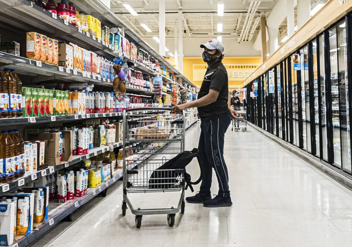 A man shops at a grocery store in Moncton, New Brunswick, on Sept. 22, 2021. (Christopher Katsarov/The Canadian Press)