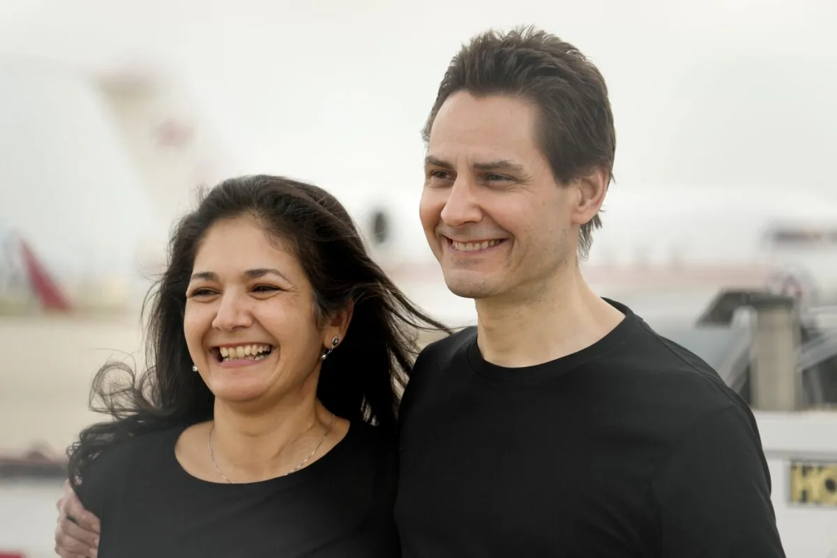 Michael Kovrig with his wife, Vina Nadjibulla, after arriving at Pearson International Airport in Toronto on Sept. 25, 2021. Kovrig and fellow Canadian Michael Spavor were imprisoned in China on baseless charges for nearly three years. (The Canadian Press/Frank Gunn)
