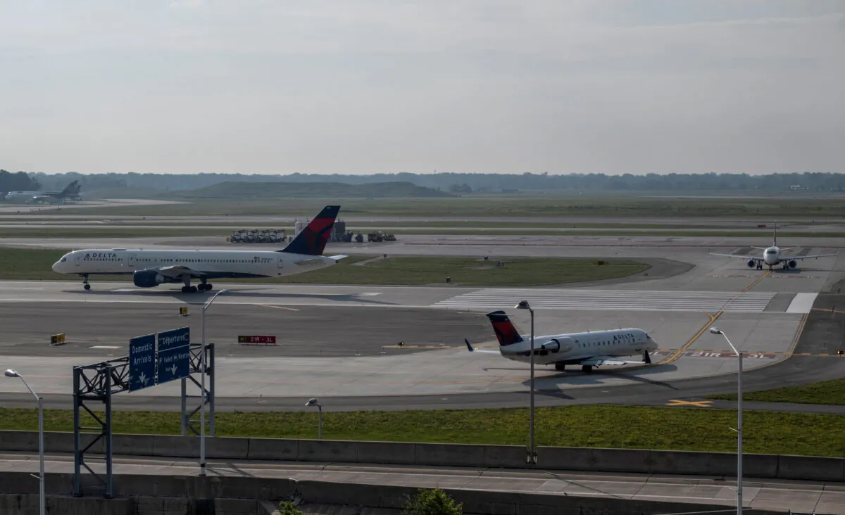 Delta Airlines passenger jets taxi on a runway at Detroit Metropolitan Wayne County Airport, in Detroit, Mich., on June 12, 2021. (Seth Herald/Reuters)
