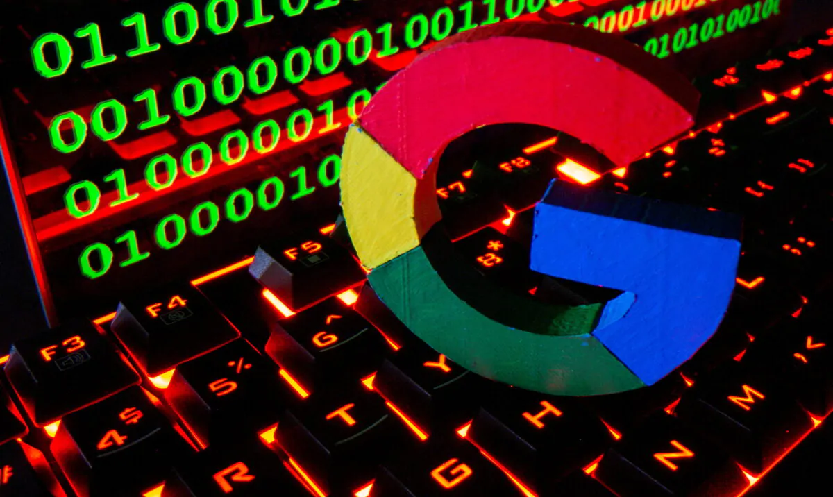 A 3D printed Google logo is pictured on a keyboard in front of binary code in this illustration taken Sept. 24, 2021. (Dado Ruvic/Reuters)