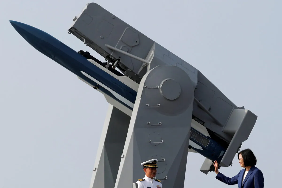 Taiwan's President Tsai Ing-wen waves to the media aboard the PFG-1112 Ming Chuan, a Perry-class guided missile frigate, after a commissioning ceremony at Kaohsiung's Zuoying naval base, Taiwan Nov. 8, 2018. (Tyrone Siu/Reuters, File Photo)