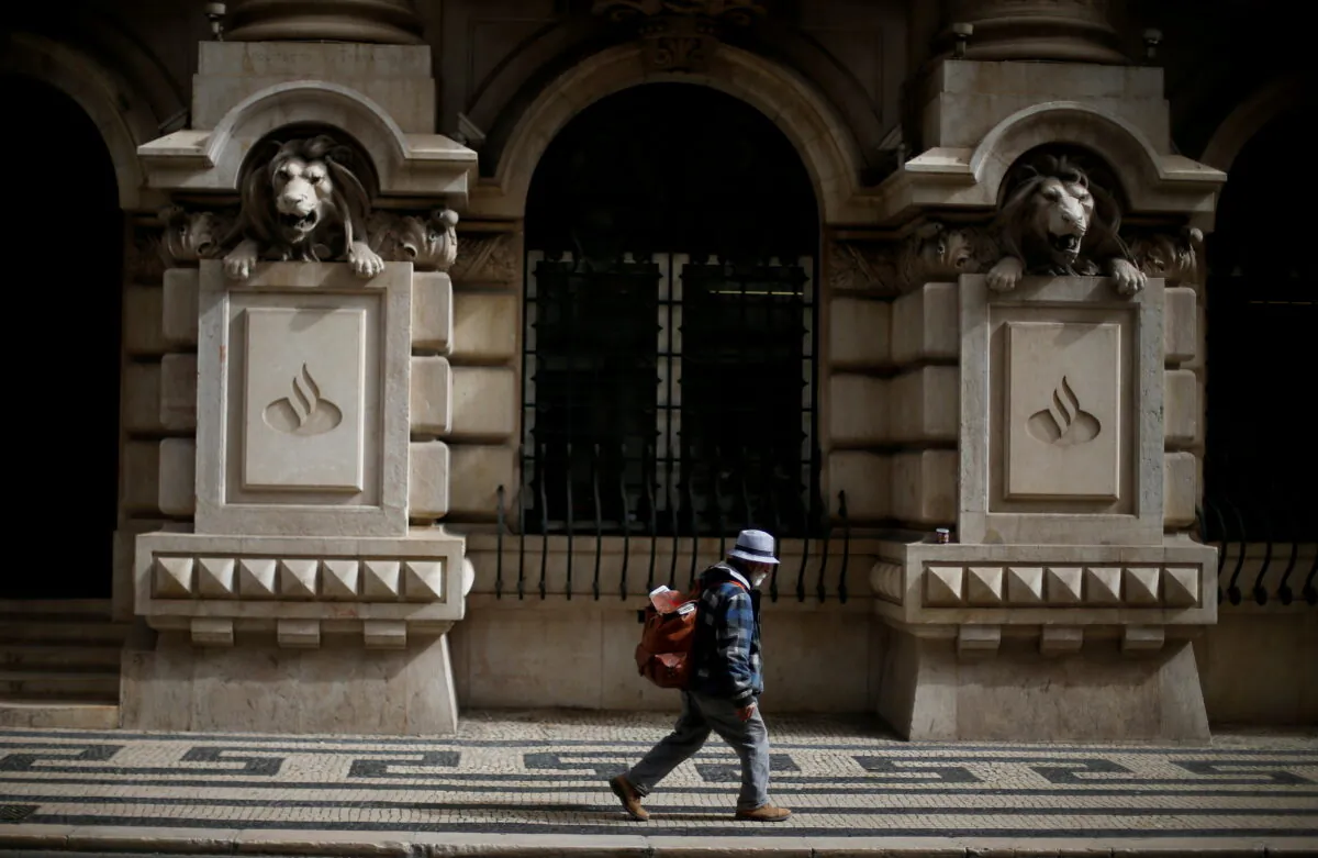 A man walks outside Santander Totta headquarters in downtown Lisbon, Portugal, on Feb. 21, 2017. (Rafael Marchante/Reuters)