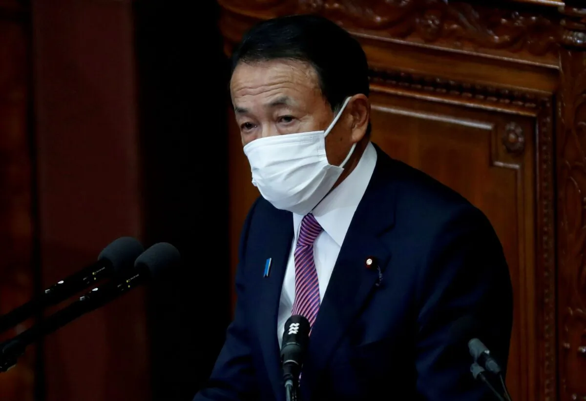 Japan's Deputy Prime Minister and Finance Minister Taro Aso, wearing a protective face mask, delivers his policy speech at the opening of an ordinary session of the parliament in Tokyo, Japan on Jan. 18, 2021. (Issei Kato/Reuters)
