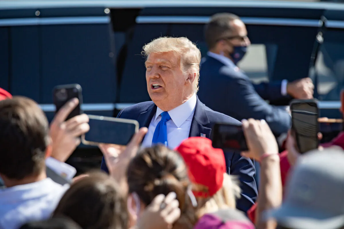 President Donald Trump greets cheering supporters at John Wayne Airport in Santa Ana, Calif., on Oct. 18, 2020. (John Fredricks/The Epoch Times)