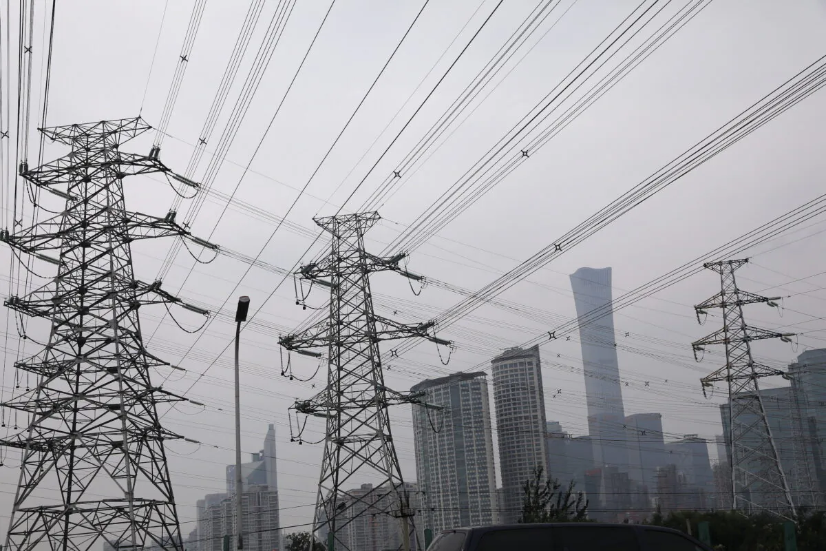 Electricity transmission towers are pictured near Beijing’s Central Business District, in China, on Sept. 28, 2021. (Tingshu Wang/Reuters)