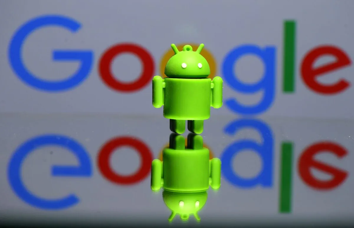 A 3D printed Android mascot Bugdroid is seen in front of a Google logo in this illustration taken on July 9, 2017. (Dado Ruvic/Illustration/Reuters)