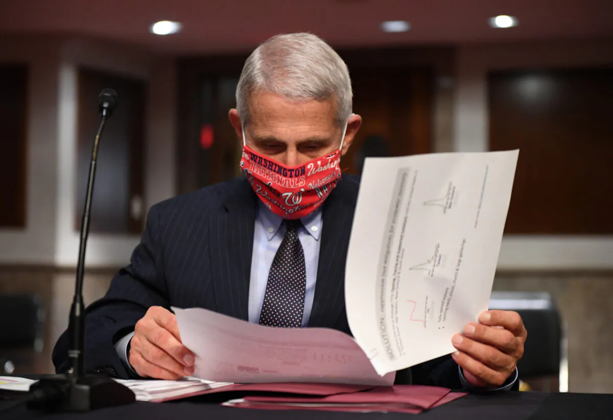 Dr. Anthony Fauci, director of the National Institute for Allergy and Infectious Diseases, prepares to testify at a hearing of the Senate Health, Education, Labor and Pensions Committee on June 30, 2020. (Kevin Dietsch-Pool/Getty Images)