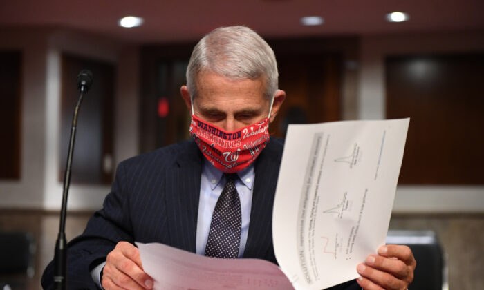 Dr. Anthony Fauci, director of the National Institute for Allergy and Infectious Diseases, prepares to testify at a hearing of the Senate Health, Education, Labor and Pensions Committee on June 30, 2020. (Kevin Dietsch-Pool/Getty Images)