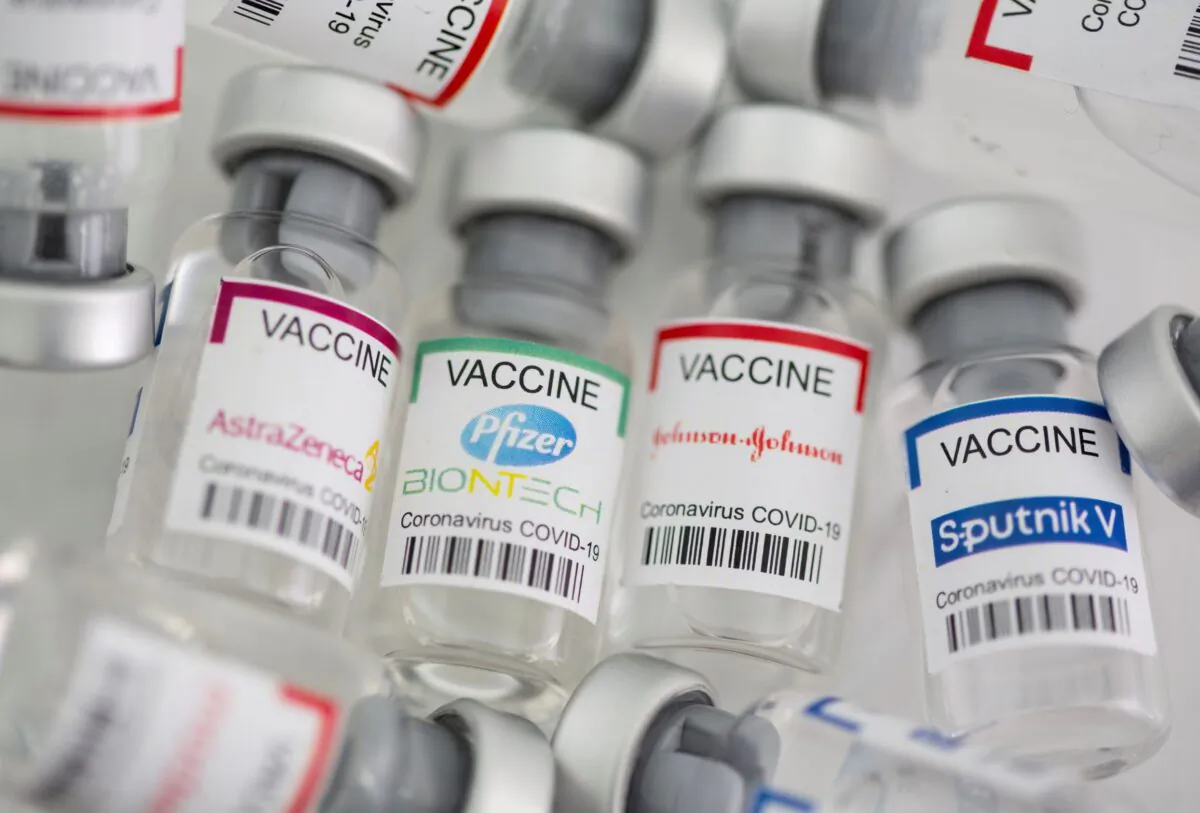 Vials labelled "AstraZeneca, Pfizer - Biontech, Johnson&Johnson, and Sputnik V COVID-19 vaccine" in this illustration picture taken on May 2, 2021. (Dado Ruvic/Illustration/Reuters)