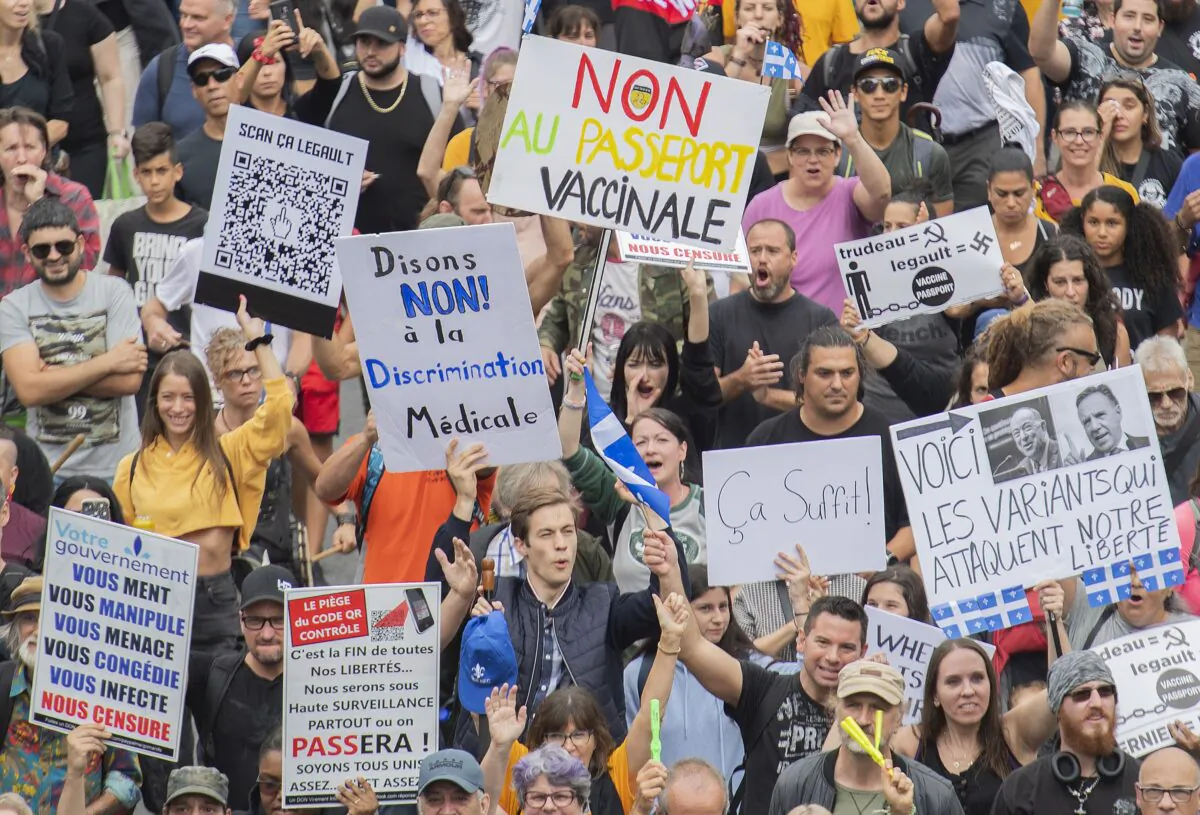 Large crowds protest against the Quebec government's mandatory vaccine policy, in Montreal on Sept. 5, 2021. (The Canadian Press/Graham Hughes)
