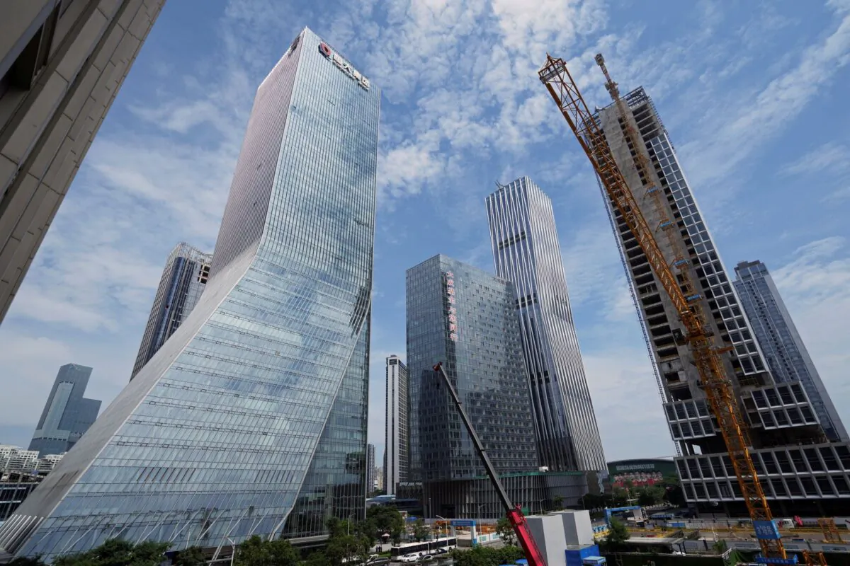 Cranes stand at a construction site near the headquarters of China Evergrande Group in Shenzhen, Guangdong Province, China, on Sept. 26, 2021. (Aly Song/Reuters)