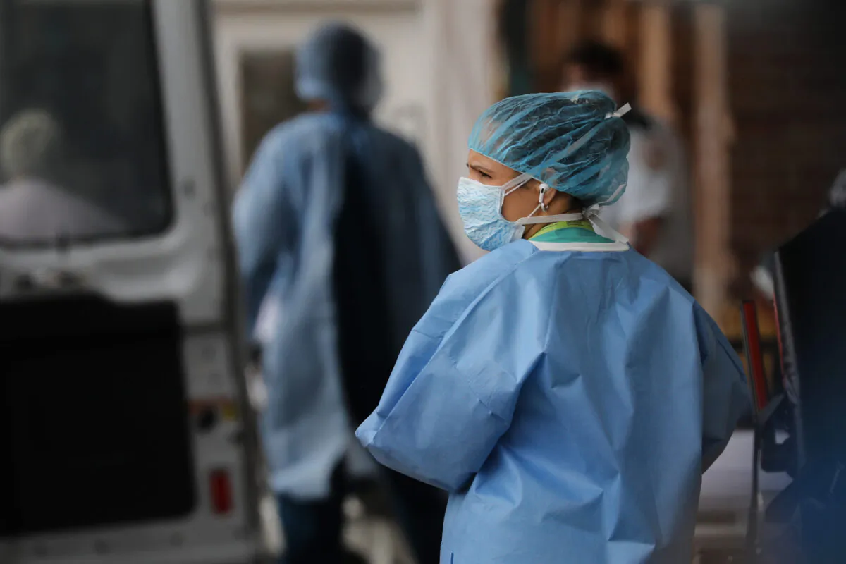 Medical workers bring in patients at a special coronavirus intake tent at Maimonides Medical Center in Borough Park section of Brooklyn on April 2, 2020. (Spencer Platt/Getty Images)
