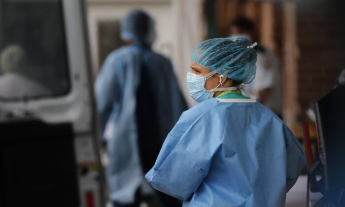 Medical workers bring in patients at a special coronavirus intake tent at Maimonides Medical Center in Borough Park section of Brooklyn on April 2, 2020. (Spencer Platt/Getty Images)