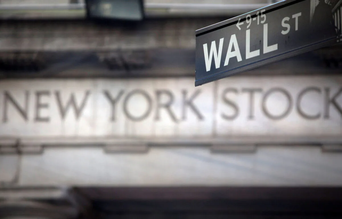 A Wall Street sign outside the New York Stock Exchange in New York on Oct. 28, 2013. (Carlo Allegri/Reuters)