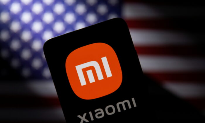 Smartphone with a Xiaomi logo is seen in front of a U.S. flag in this illustration taken on Sept. 28, 2021. (Dado Ruvic/Reuters)