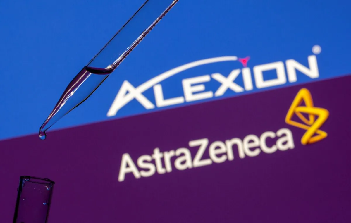 A test tube is seen in front of displayed Alexion Pharma and AstraZeneca logos in this illustration taken on July 14, 2021. (Dado Ruvic/Illustration/Reuters)