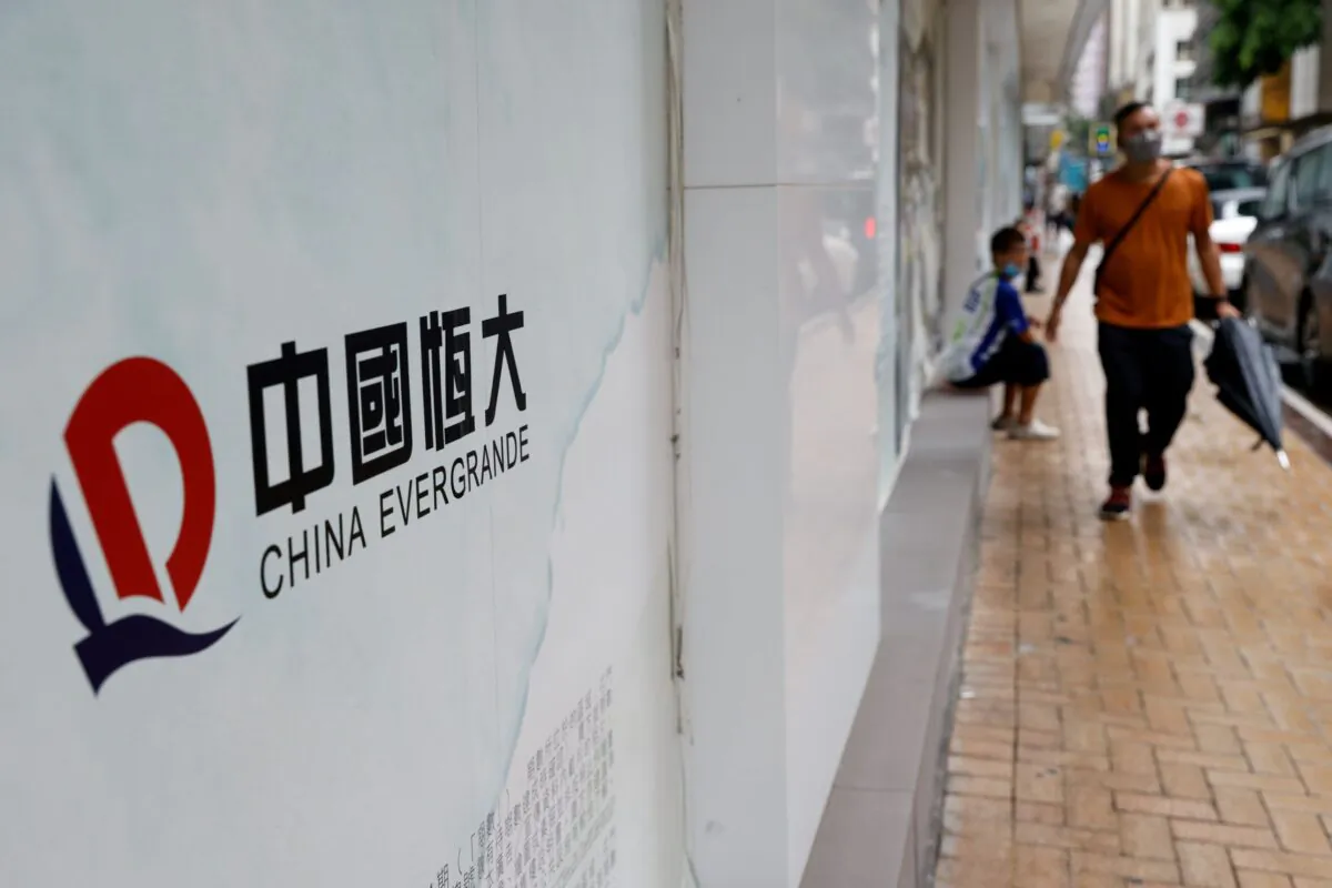 The China Evergrande logo is displayed outside China Evergrande Centre building in Hong Kong, on Sept. 23, 2021. (Tyrone Siu/Reuters)