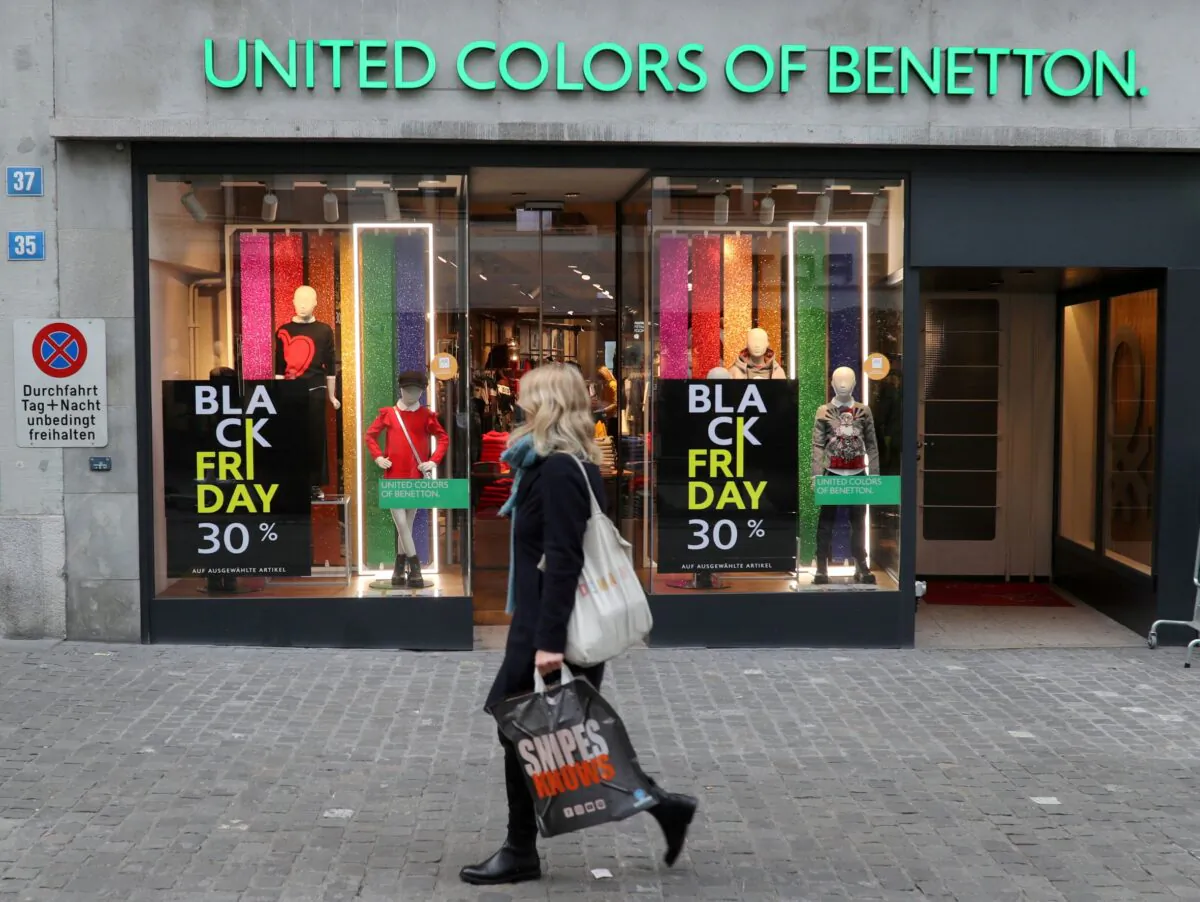 Posters offering special discount on Black Friday sales are seen in front of a United Colors of Benetton kid's fashion store in Zurich, Switzerland on Nov. 27, 2020. (Arnd Wiegmann/Reuters)