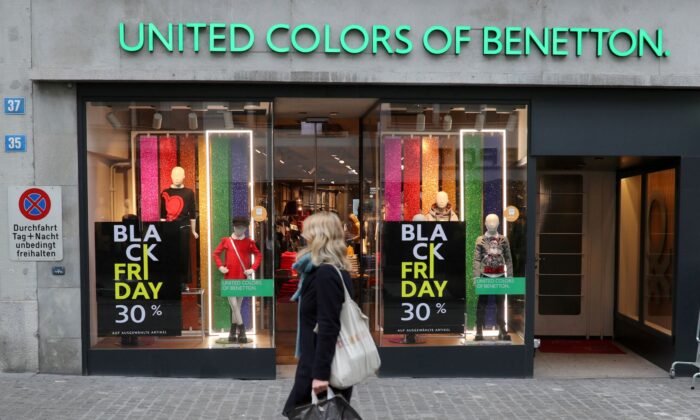 Posters offering special discount on Black Friday sales are seen in front of a United Colors of Benetton kid's fashion store in Zurich, Switzerland on Nov. 27, 2020. (Arnd Wiegmann/Reuters)