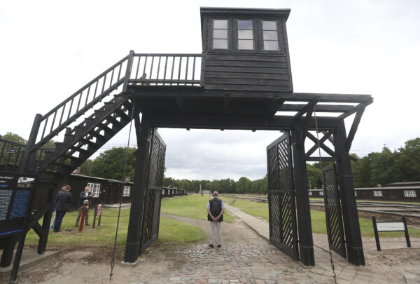 the wooden main gate leads into the former Nazi German Stutthof concentration camp