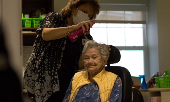 Care giver treats hair of nursing home resident at a Quality Life Services facility in western Pennsylvania. (Courtesy of the Pennsylvania Health Care Association)