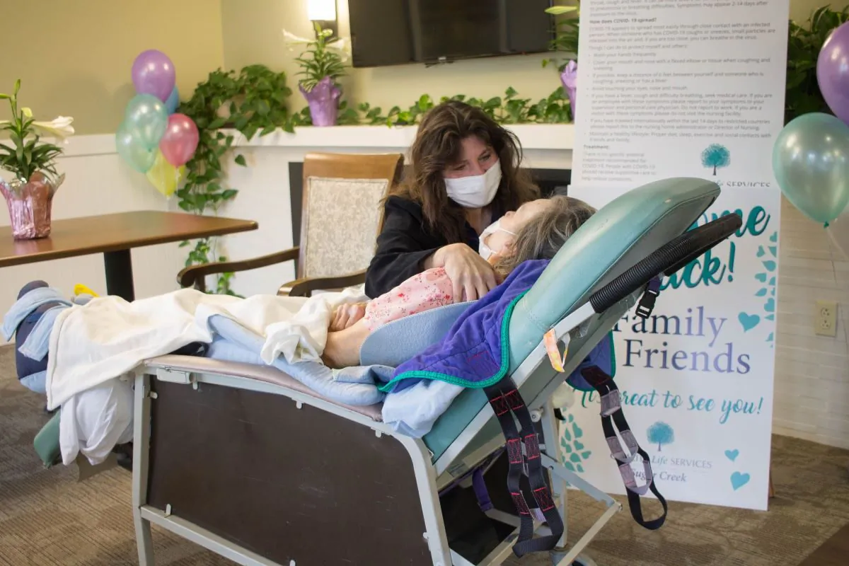 Care giver visits with nursing home resident at a Quality Life Services facility in western Pennsylvania. (Courtesy of the Pennsylvania Health Care Association)