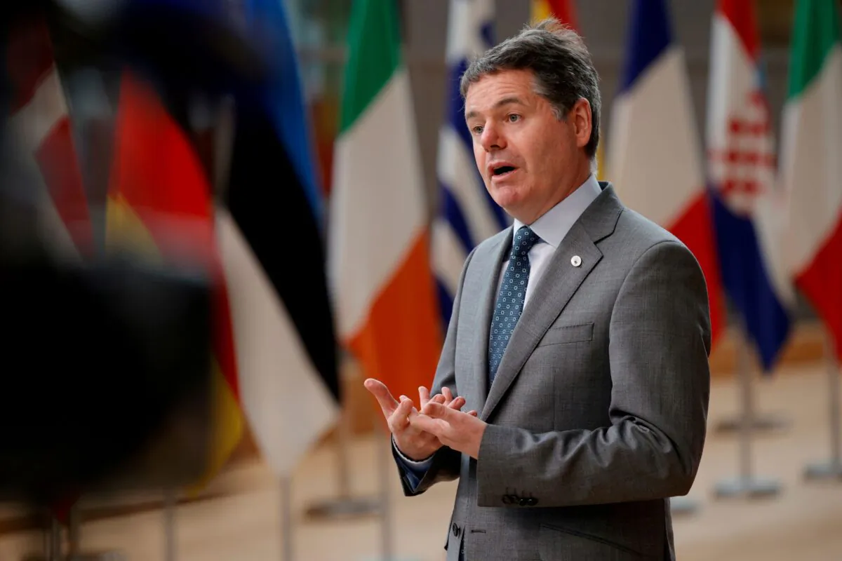 Eurogroup President Paschal Donohoe talks to journalists as he arrives for the second day of an EU summit at the European Council building in Brussels, Belgium, on June 25, 2021. (Olivier Matthys/Pool via Reuters)