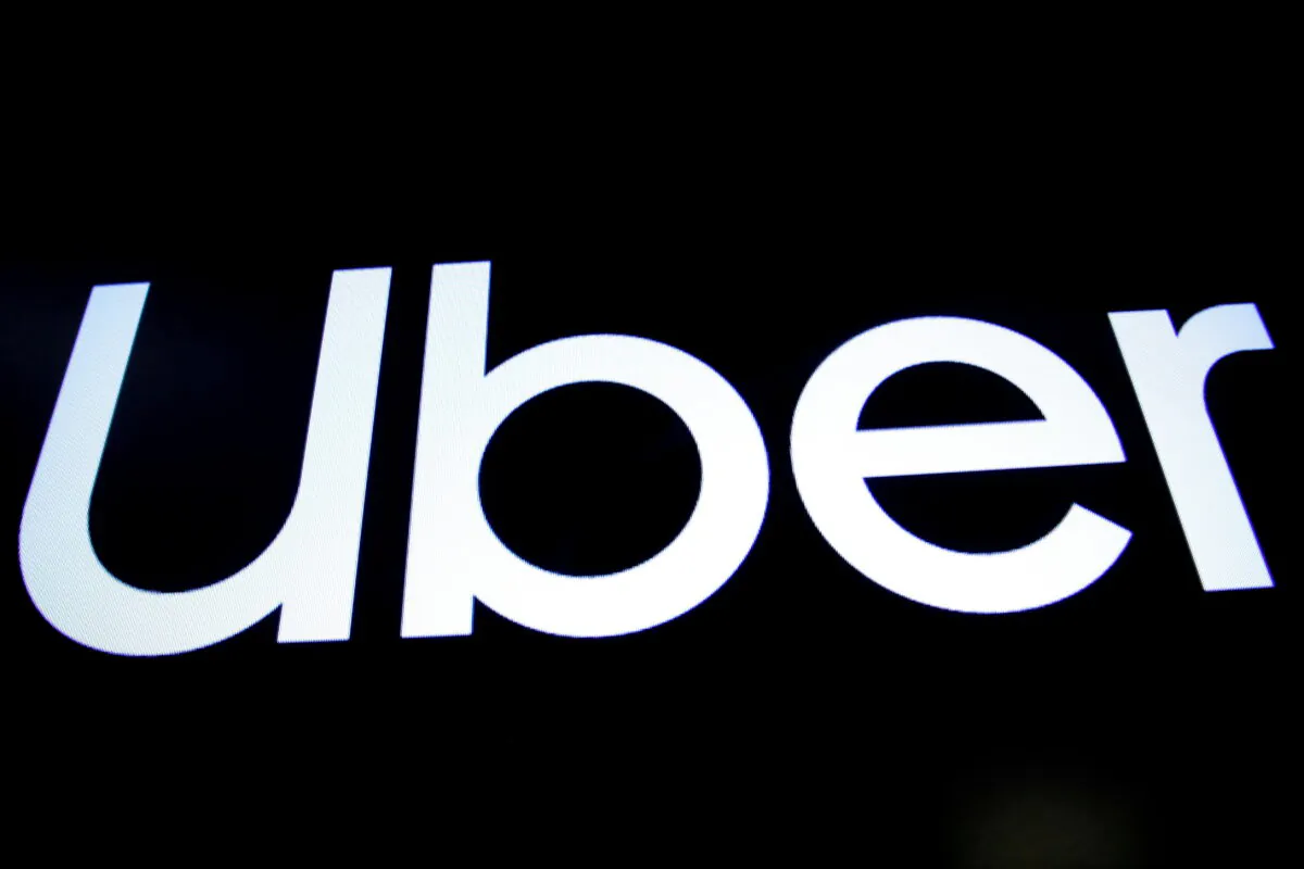 A screen displays the company logo of Uber Technologies Inc. on the day of its IPO at the New York Stock Exchange (NYSE) in New York on May 10, 2019. (Brendan McDermid/Reuters)